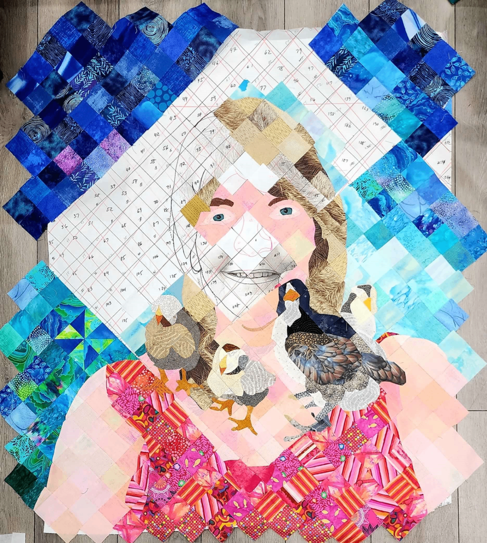 Partially assembled quilt showing blue tones