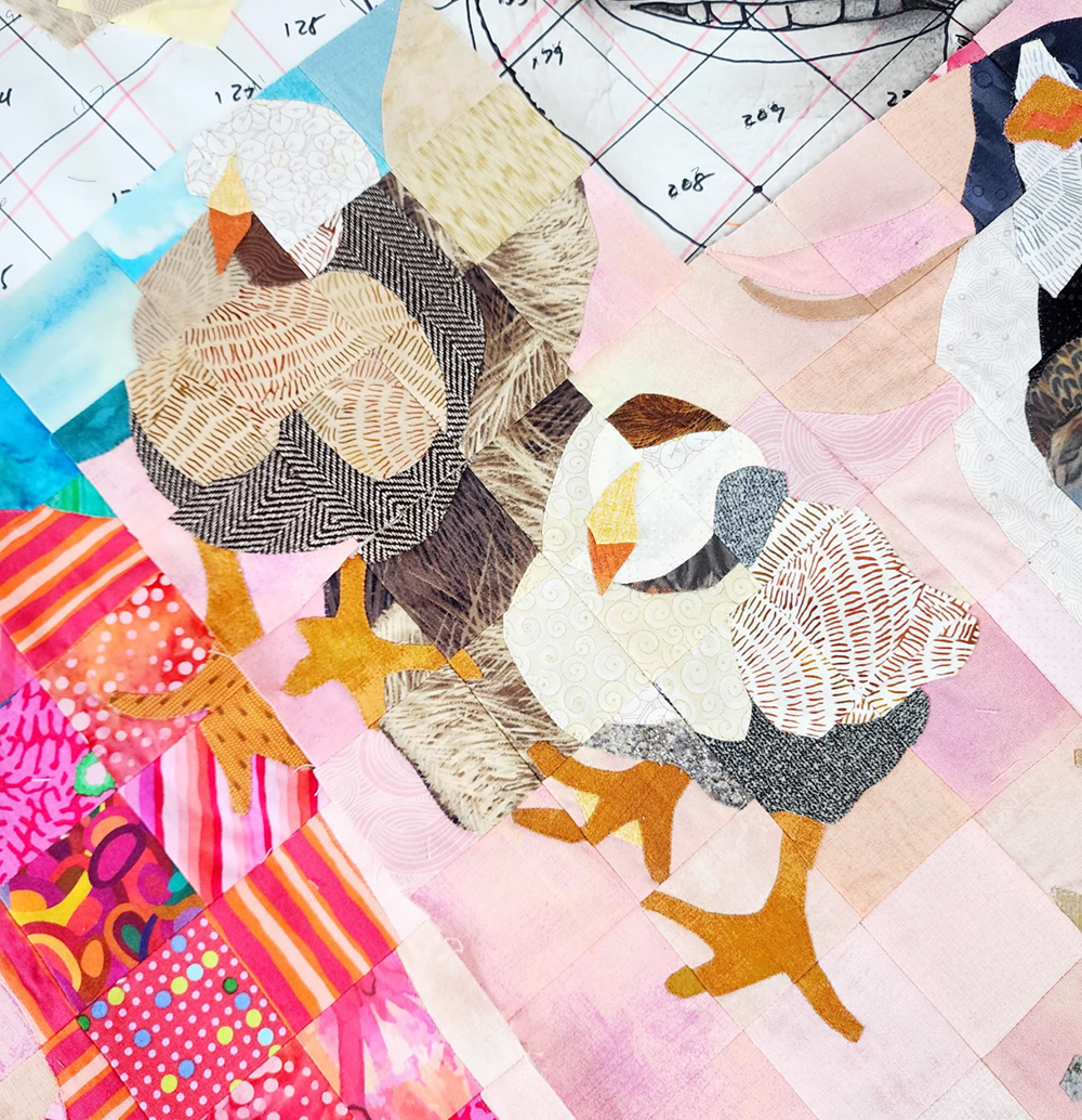 Chickens on the quilt seen up close